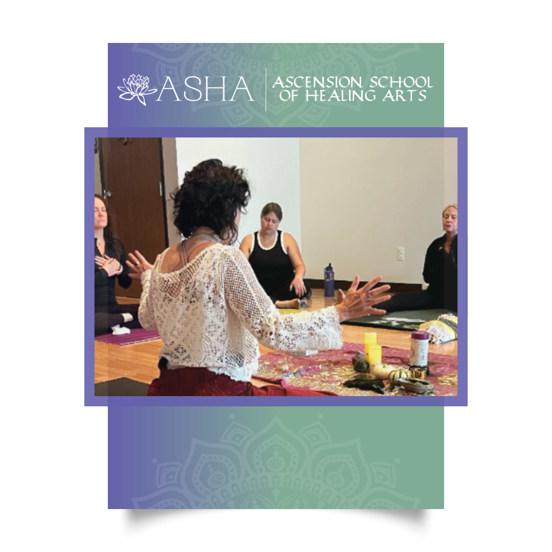 Donna Lakes in a lace shawl with her arms raised, leading a group of standing students through a practice at the ASHA studio